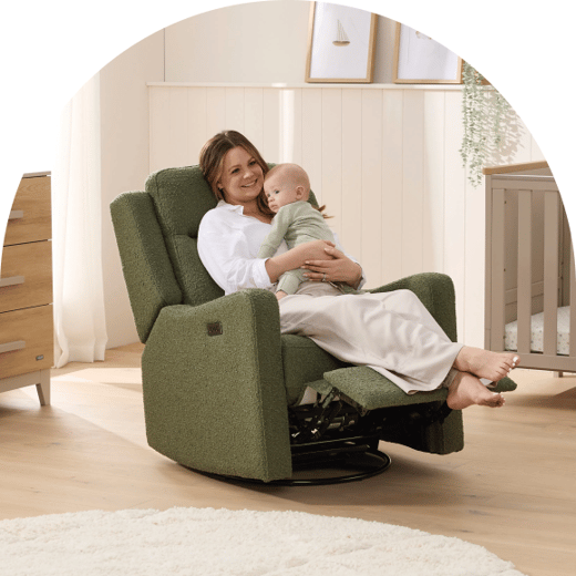 Parent and baby in a styled nursery